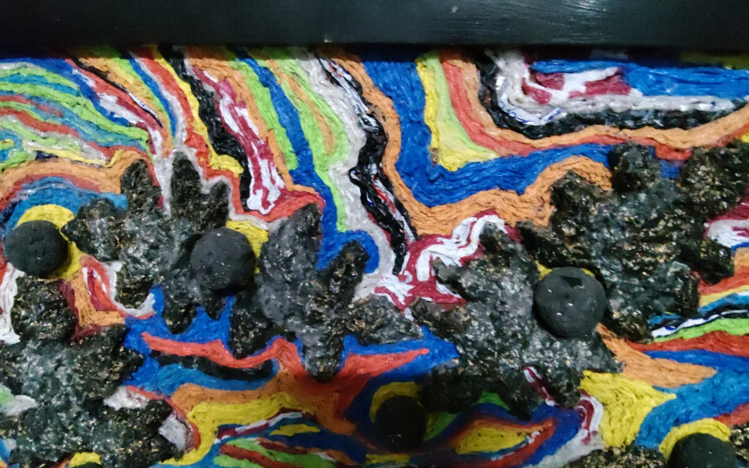 Colorful original artwork displayed at Ka Insó Galeri & Museo